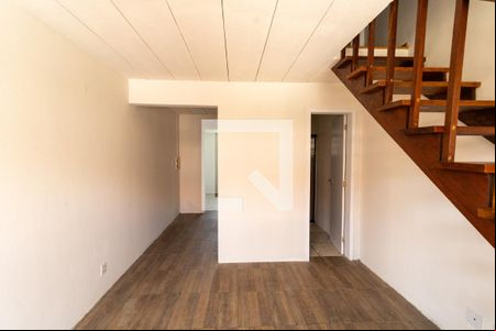 Sala de casa de condomínio à venda com 2 quartos, 50m² em Vila Nova, Porto Alegre