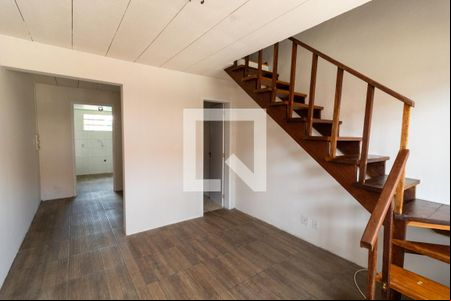 Sala de casa de condomínio à venda com 2 quartos, 50m² em Vila Nova, Porto Alegre