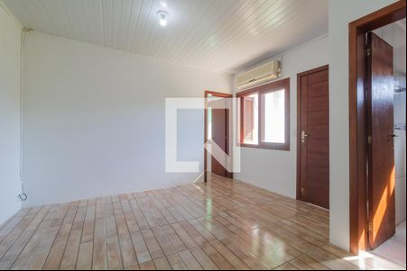 Sala de casa de condomínio para alugar com 1 quarto, 32m² em Vila Nova, Porto Alegre